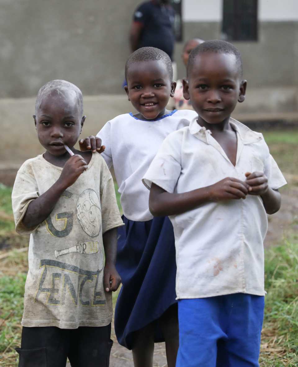 Three boys smiling to camera